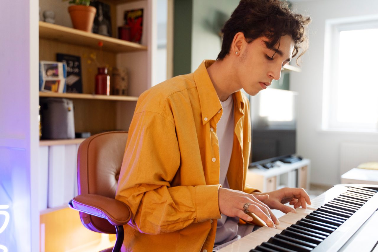 teen-playing-piano-side-view